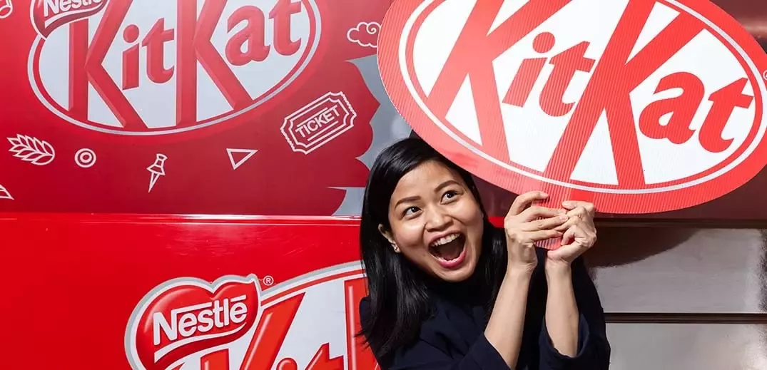 woman with KitKat banner